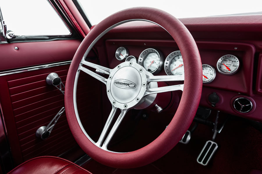 Red leather grip steering wheel with custom brushed finish