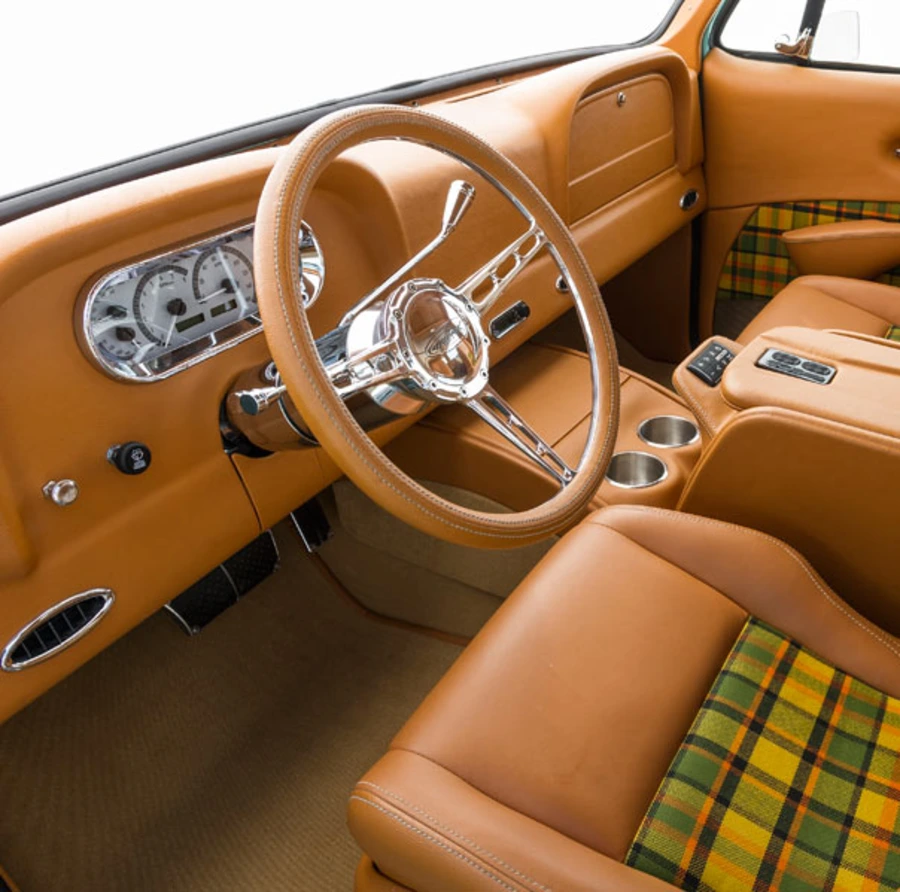 Custom wrapped leather grip steering wheel in tan and polished aluminum